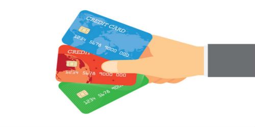Man_holding_multiple_credit_cards_logo3in1_Fotolia.jpg